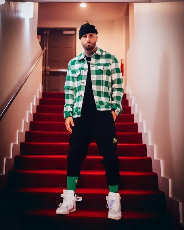 Nicky Jam outfit in Palm Angels, Stone Island, and Eric Emanuel, 2021