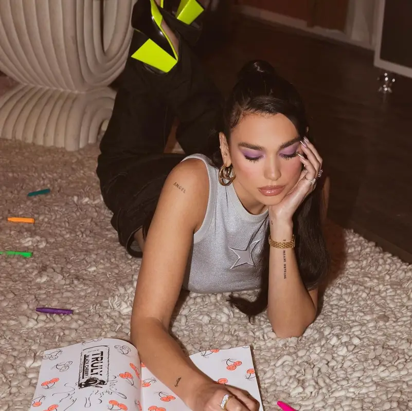 Dua Lipa outfit in Marc Jacobs, Jennifer Fisher, and The Attico, 2021