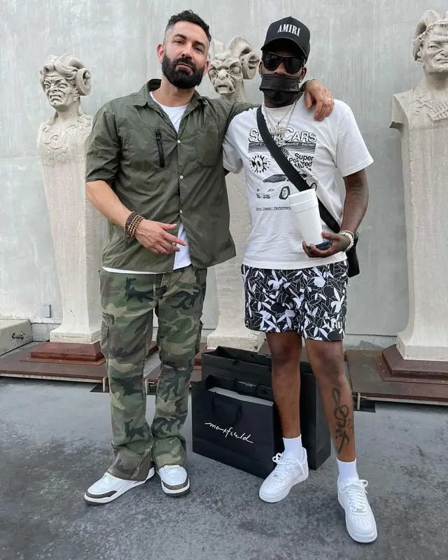 Lil Duke outfit in Catchy Design Studio, Givenchy, and Amiri, 2021