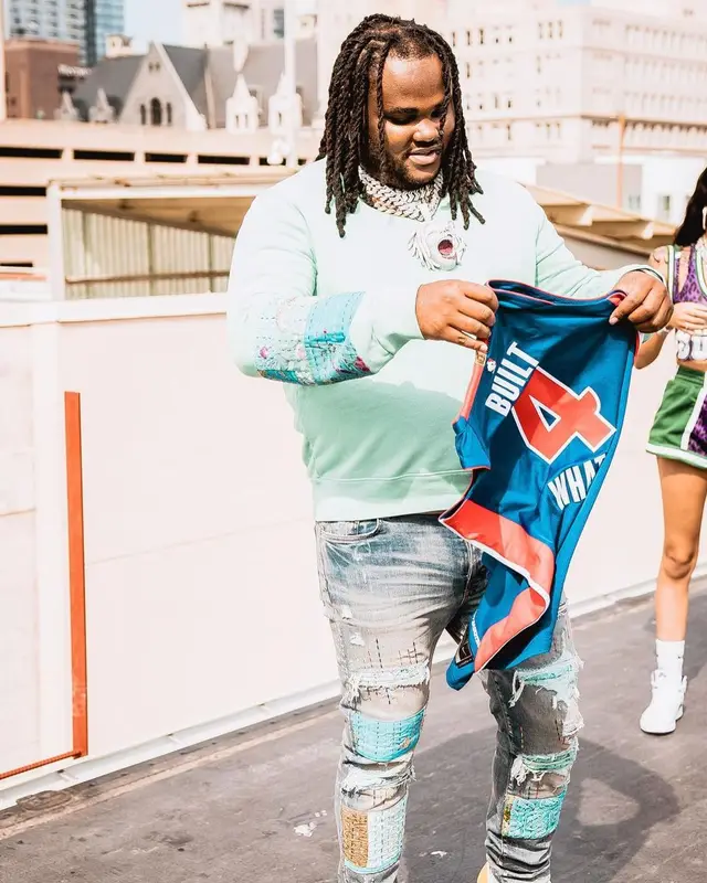 Tee Grizzley outfit in Amiri, 2021