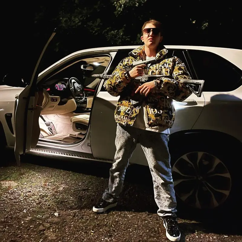 Yung Trappa outfit in Versace, Valentino, and Gucci, 2021