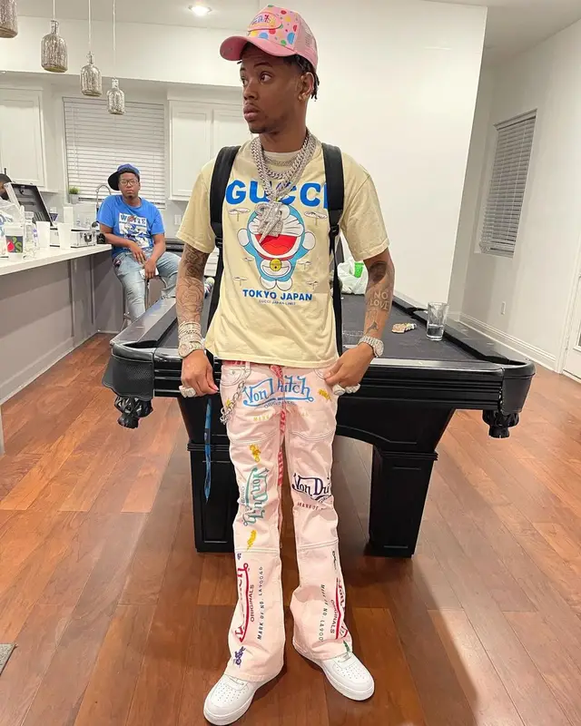 Lil Migo outfit in Gucci, Von Dutch, and Doraemon, 2021