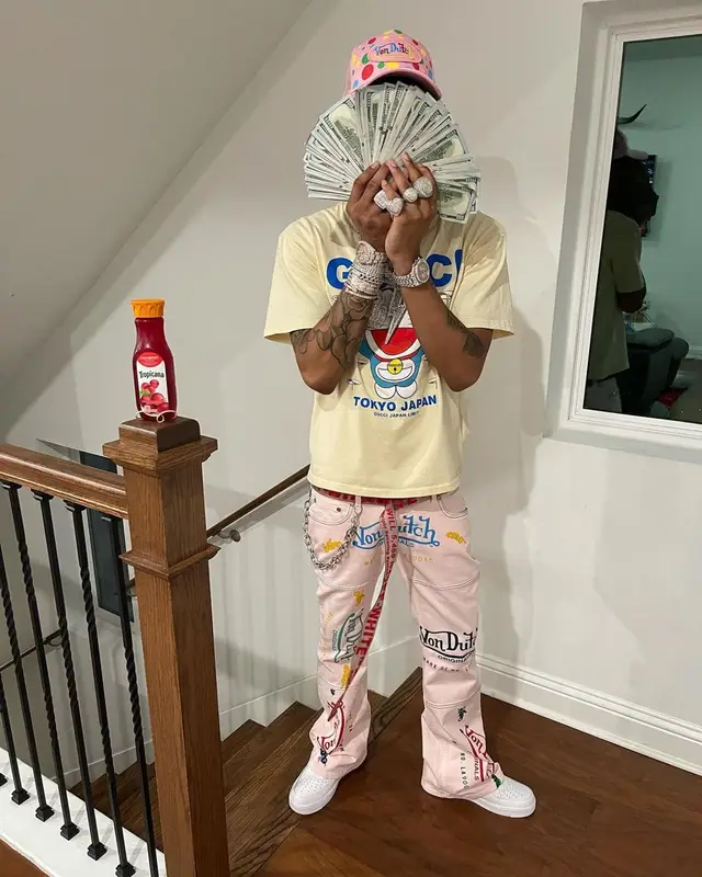 Lil Migo outfit in Gucci, Von Dutch, and Doraemon, 2021