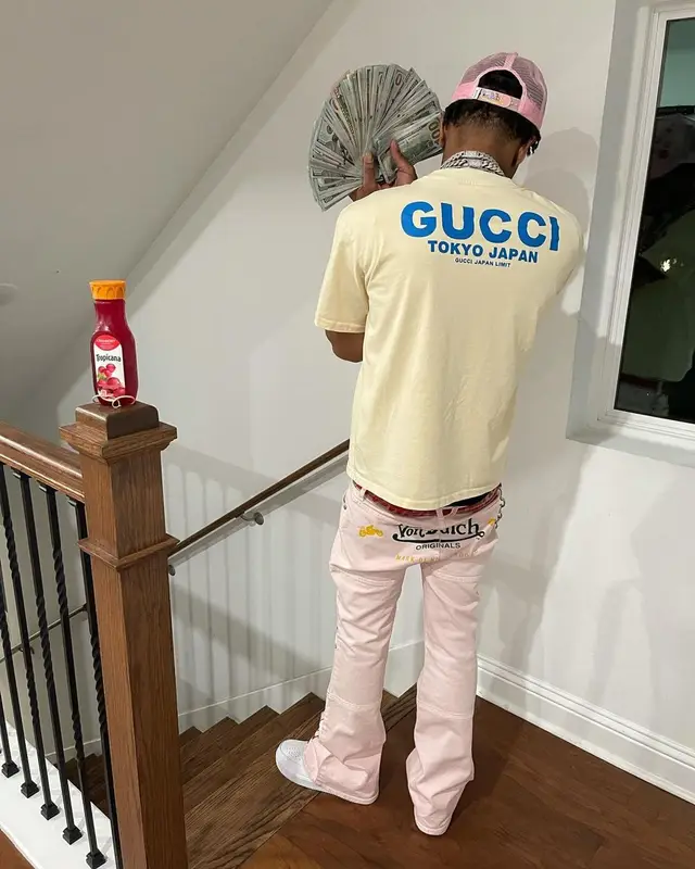 Lil Migo outfit in Gucci, Von Dutch, and Doraemon, 2021