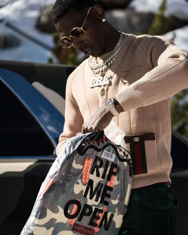 Young Dolph outfit in Sprayground, Gucci, and Young Dolph Merch, 2021