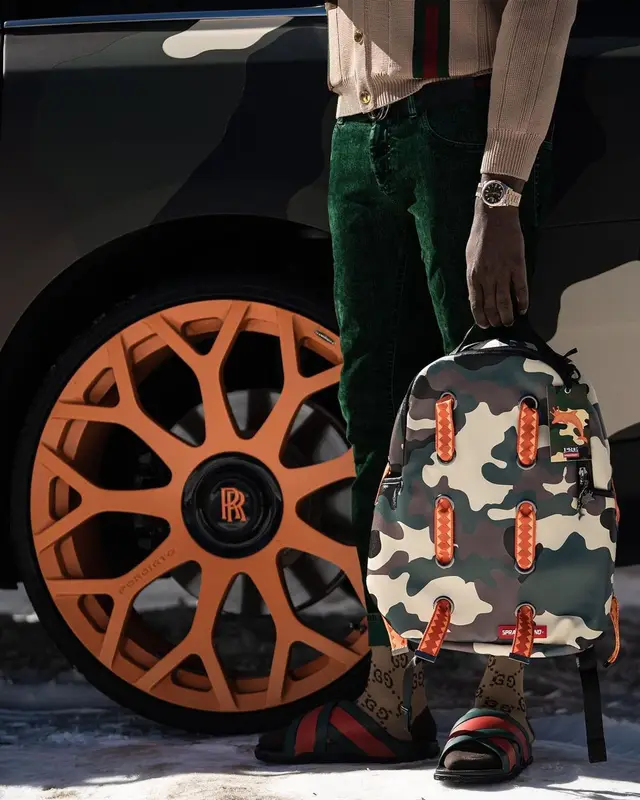 Young Dolph outfit in Sprayground, Gucci, and Young Dolph Merch, 2021
