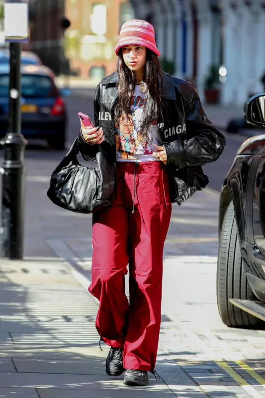 Dua Lipa outfit in Balenciaga, Puma, and Bottega Veneta, 2021