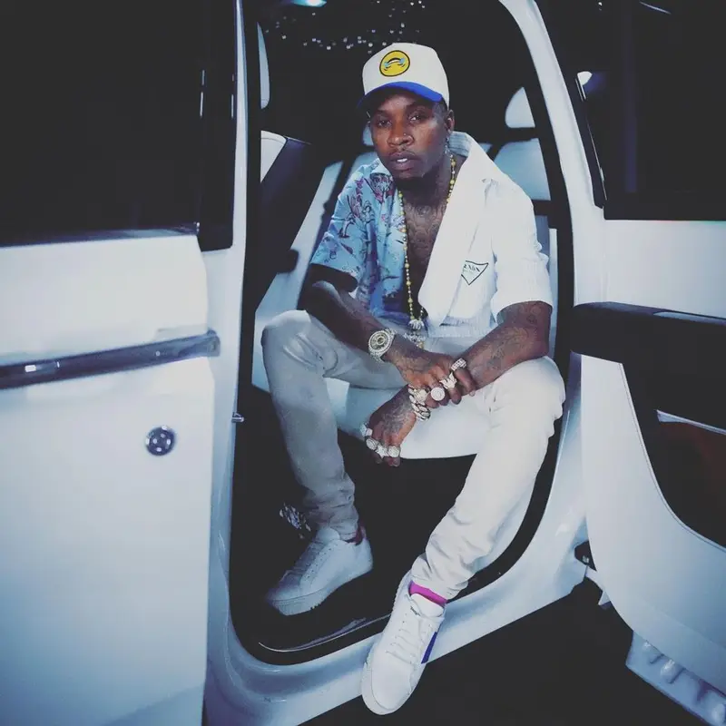 Tory Lanez outfit in Prada, Louis Vuitton, and NBA, 2021