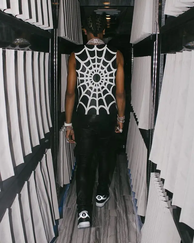 Lil Baby outfit in Supreme, Amiri, and Nike, 2021
