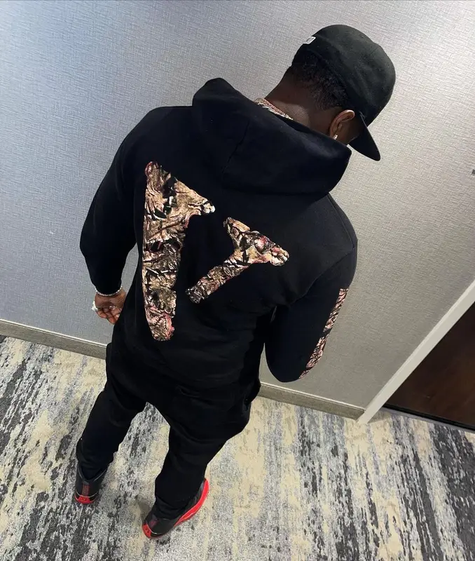 Bankroll Freddie outfit in Vlone, Jordan, and New Era, 2021