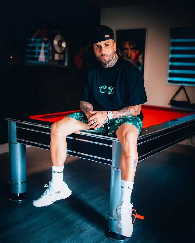 Nicky Jam outfit in Dior, Nike, and Balenciaga, 2021