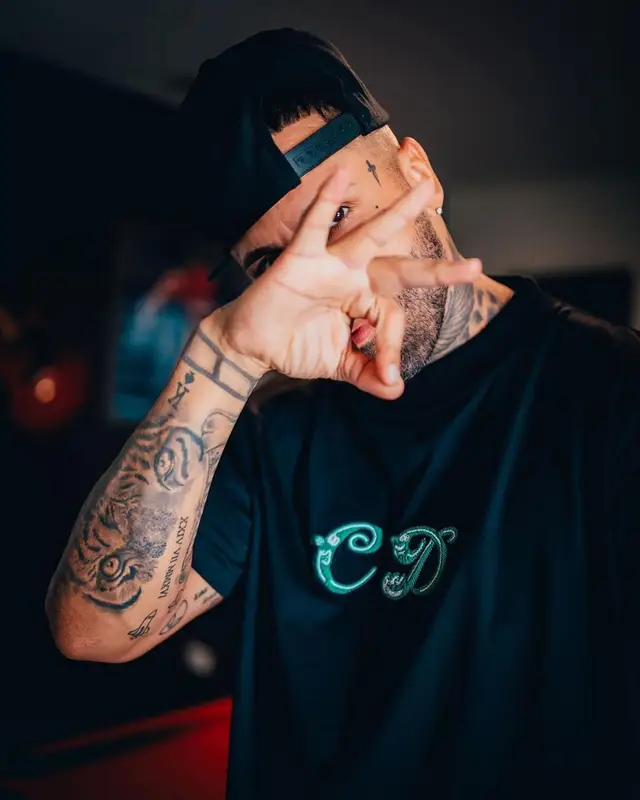 Nicky Jam outfit in Dior, Nike, and Balenciaga, 2021
