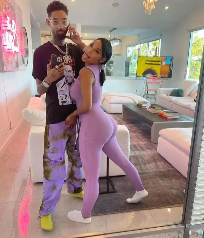 PnB Rock outfit in Catchy Design Studio, Palm Angels, and Louis Vuitton, 2021