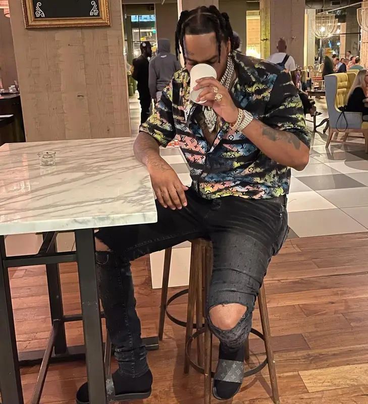 Fivio Foreign outfit in Amiri, Louis Vuitton, and Tom Ford, 2021