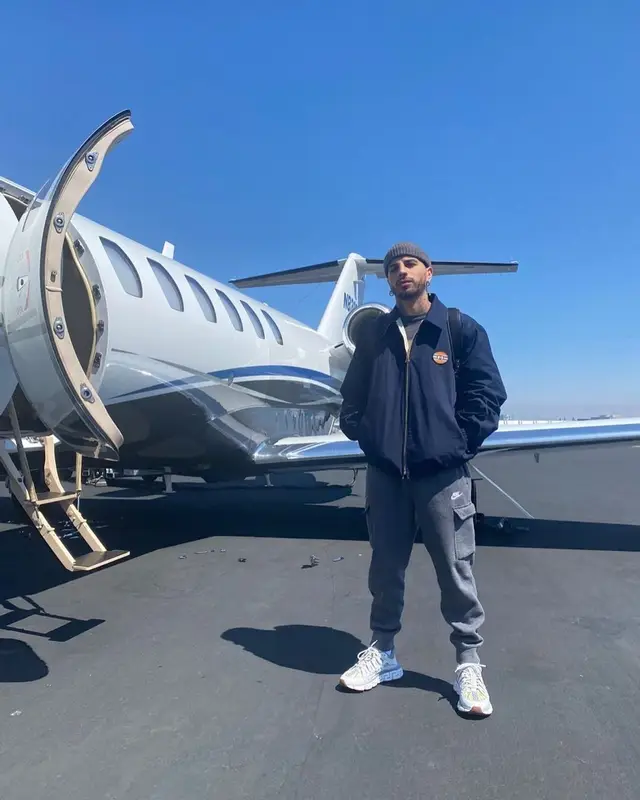 Rauw Alejandro outfit in Gucci, Nike, and Versace, 2021