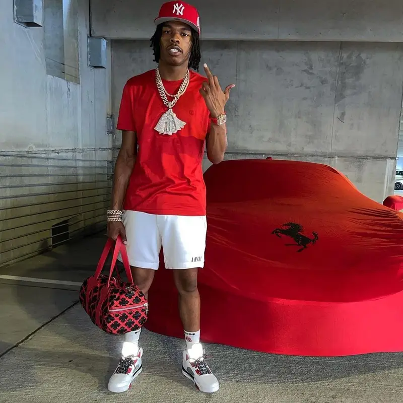 Lil Baby outfit in Louis Vuitton, Amiri, and Chrome Hearts, 2021