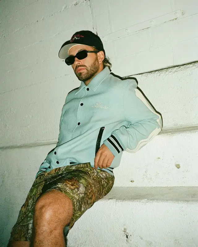 Feid outfit in Amiri, Supreme, and Nike, 2021