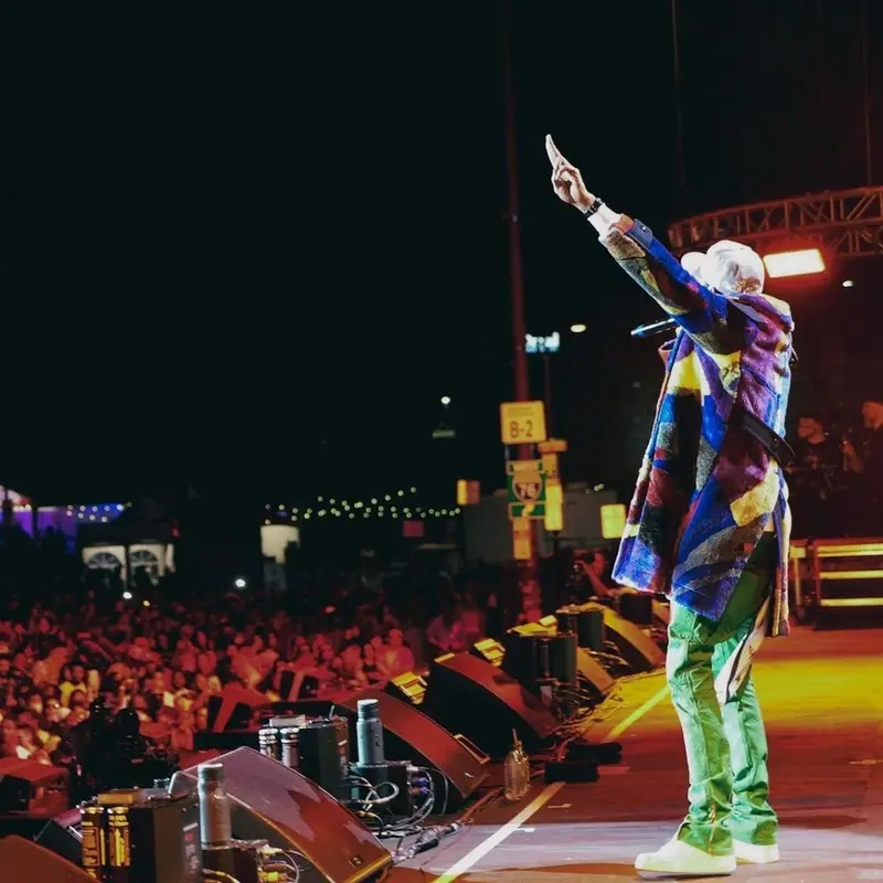 Meek Mill outfit in Sacai, Louis Vuitton, and   Kaws, 2021
