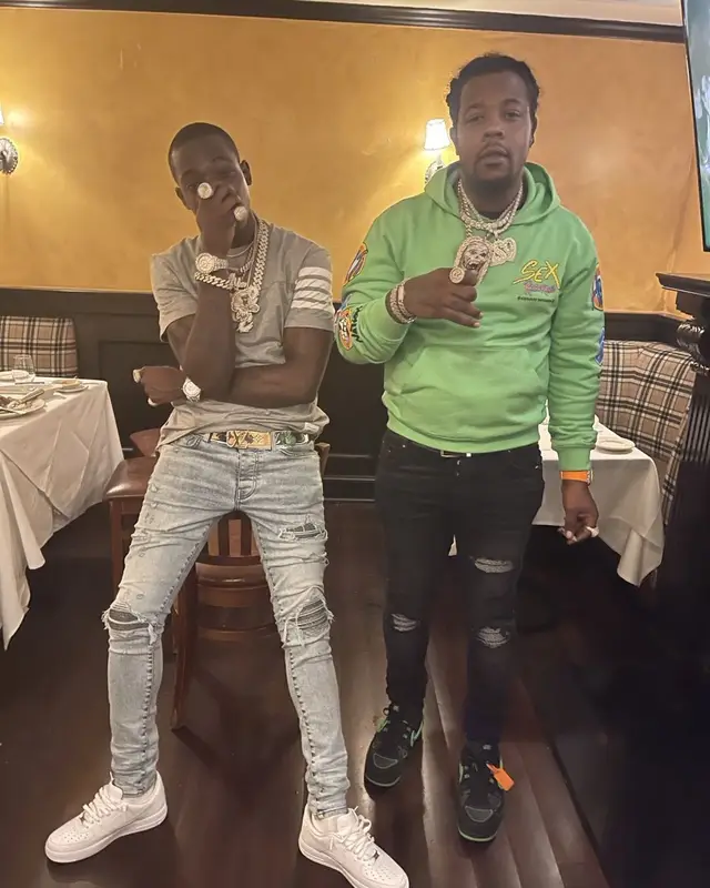 Bobby Shmurda outfit in Thom Browne, Amiri, and Louis Vuitton, 2021