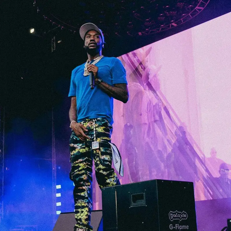 Meek Mill outfit in Louis Vuitton, Richard Mille, and Paper Planes, 2021