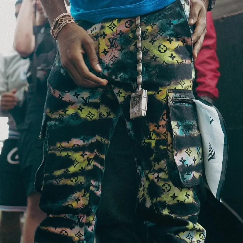 Meek Mill outfit in Louis Vuitton, Richard Mille, and Paper Planes, 2021