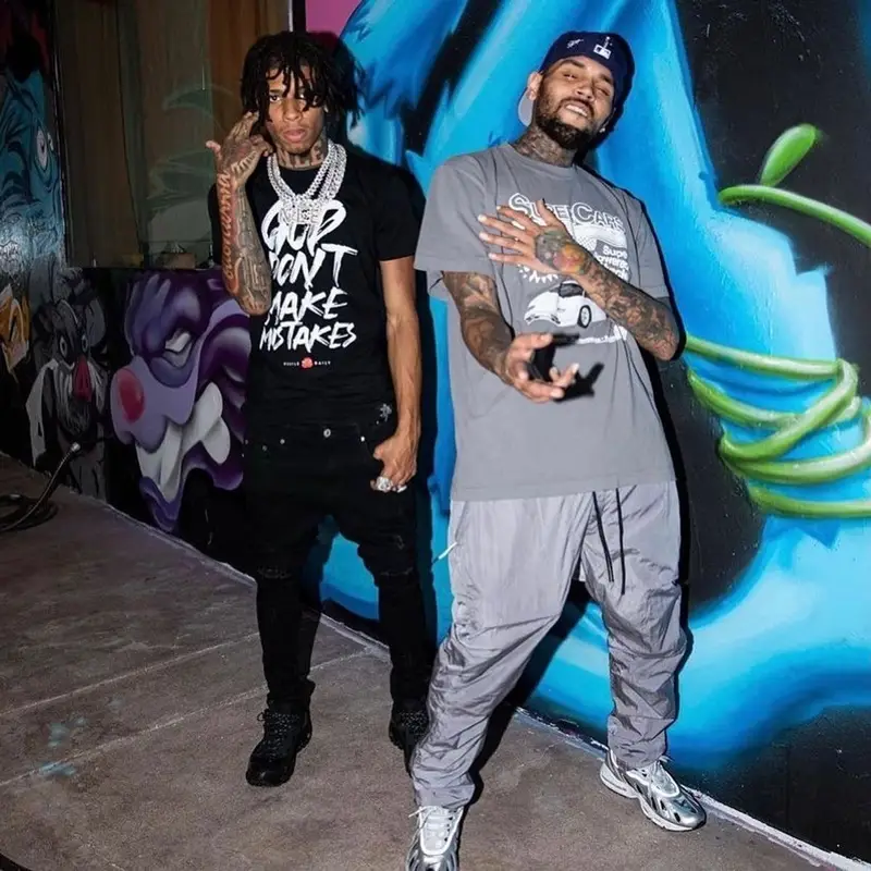 Chris Brown outfit in Catchy Design Studio, Nike, and New Era, 2021
