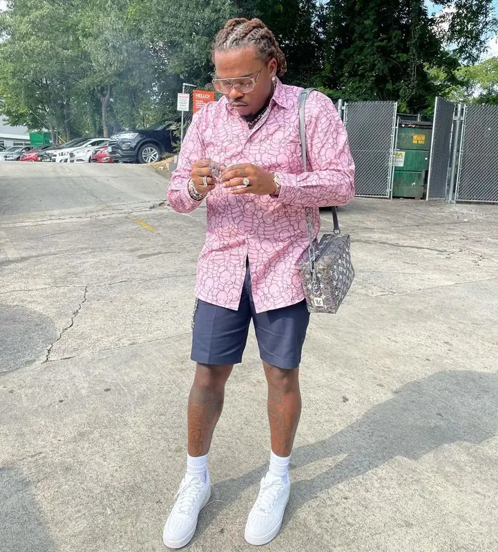 Gunna outfit in Comme Des Garcons, Bottega Veneta, and   Kaws, 2021