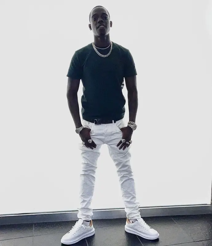 Bobby Shmurda outfit in Thom Browne and Louis Vuitton, 2021