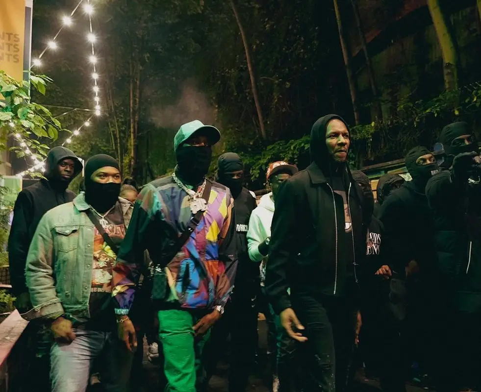 Meek Mill outfit in Sacai, Louis Vuitton, and   Kaws, 2021