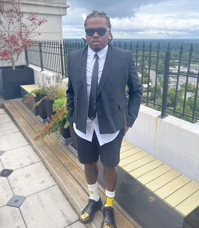 Gunna outfit in Alyx, Louis Vuitton, and Alexander McQueen, 2021