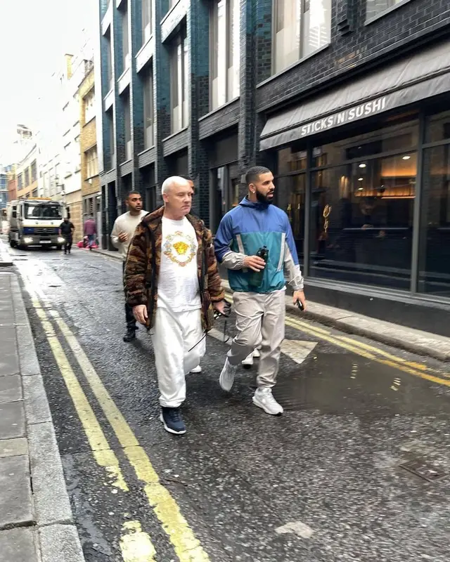 Drake outfit in Nike, Sacai, and Fragment, 2021