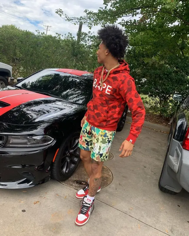 Mikey outfit in Bape, El Capitan Cartel, and Nike, 2021