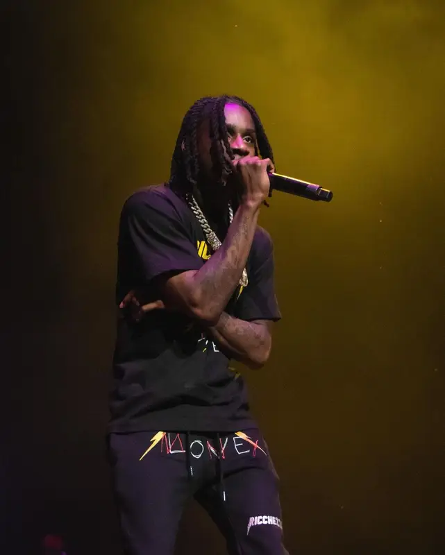 Polo G outfit in Ricchezza Forever, Chrome Hearts, and Jordan, 2021