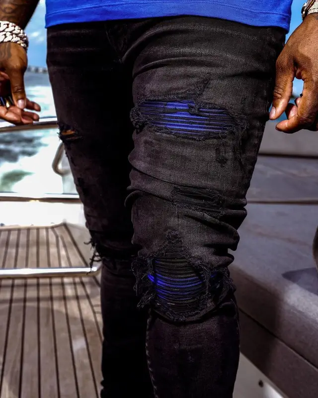 BandMan Kevo outfit in Versace and Amiri, 2021