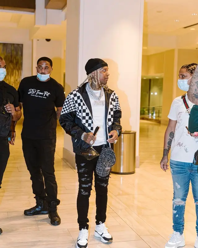 Lil Durk outfit in Celine, Amiri, and Louis Vuitton, 2021