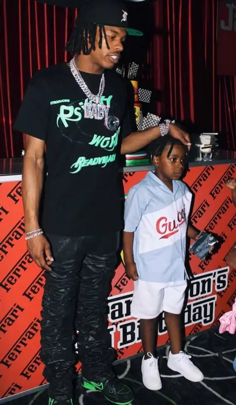 Lil Baby outfit in Readymade, Fear of God, and New Era, 2021