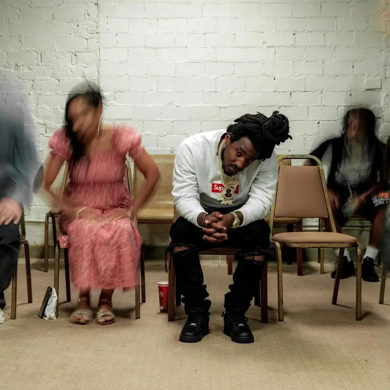 Mozzy outfit in Supreme, Amiri, and Nike, 2021
