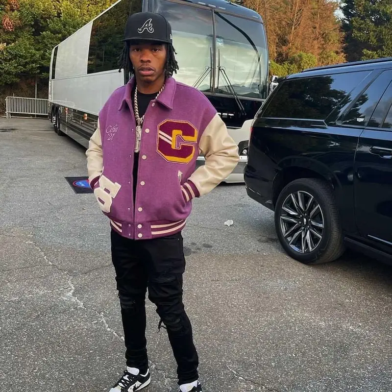 Lil Baby outfit in Amiri, Supreme, and New Era, 2021