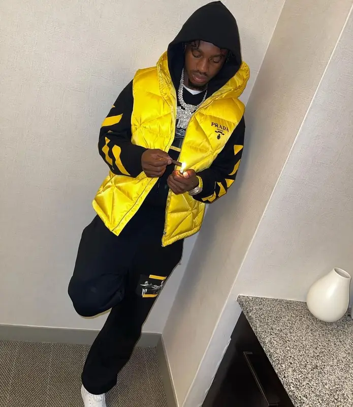 Lil Tjay outfit in Prada, Off-White, and Supreme, 2021