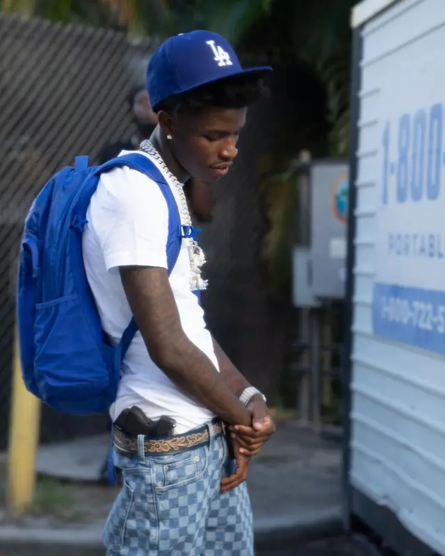 Quando Rondo outfit in PacSun, Supreme, and New Era, 2021