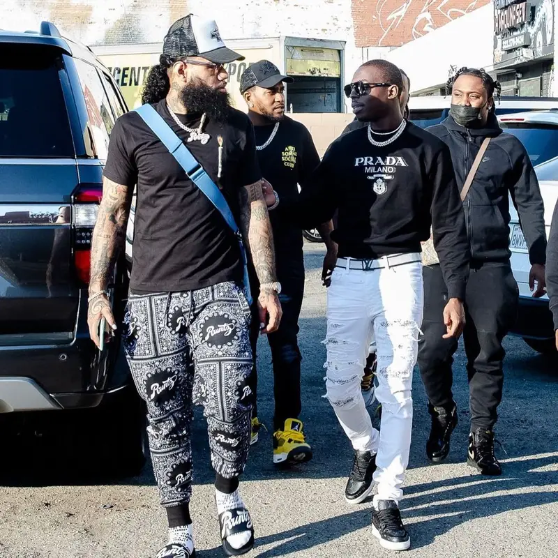 Bobby Shmurda outfit in Prada, Amiri, and Louis Vuitton, 2021