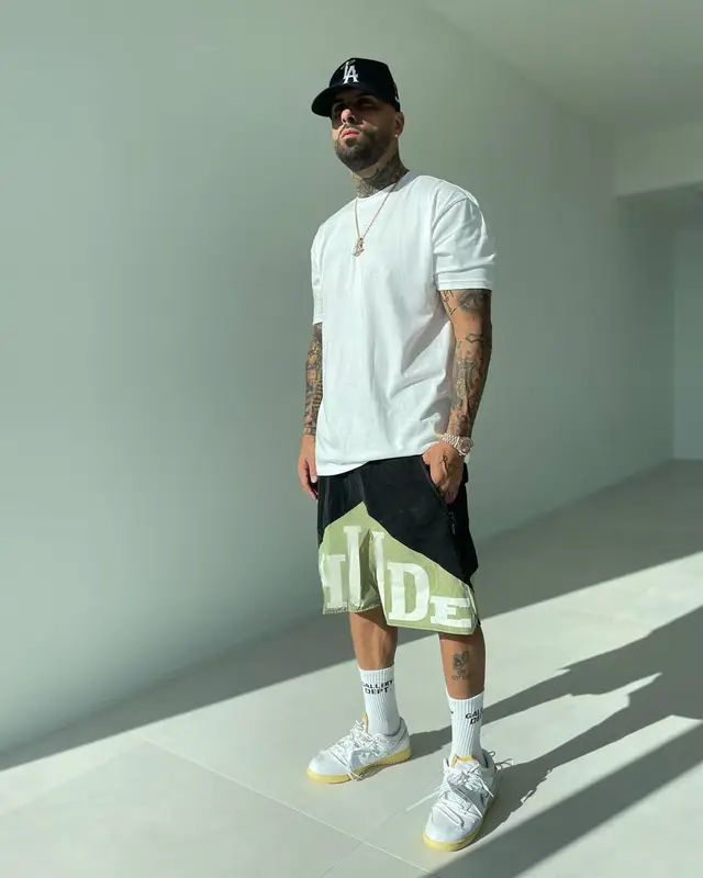 Nicky Jam outfit in Rhude, Nike, and Gallery Dept., 2021