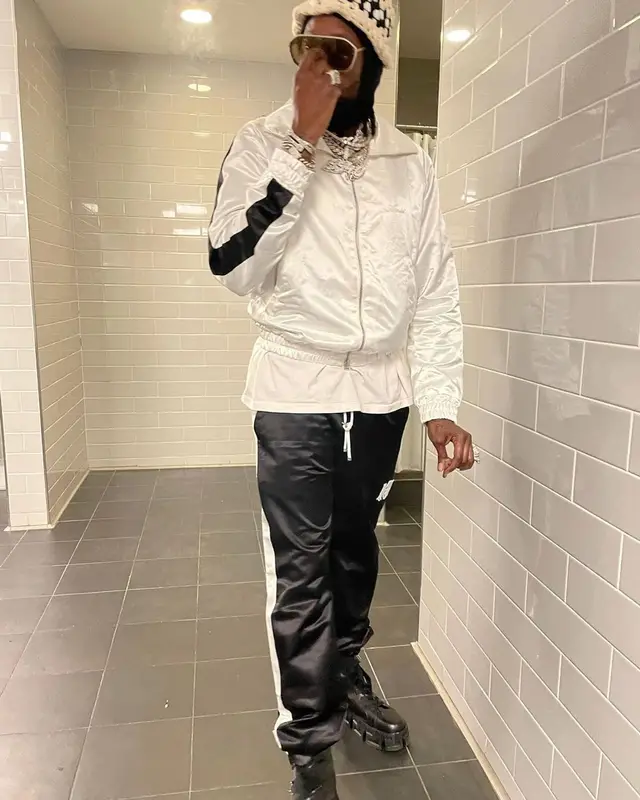 2 Chainz outfit in Versace, Fendi, and Amiri, 2021