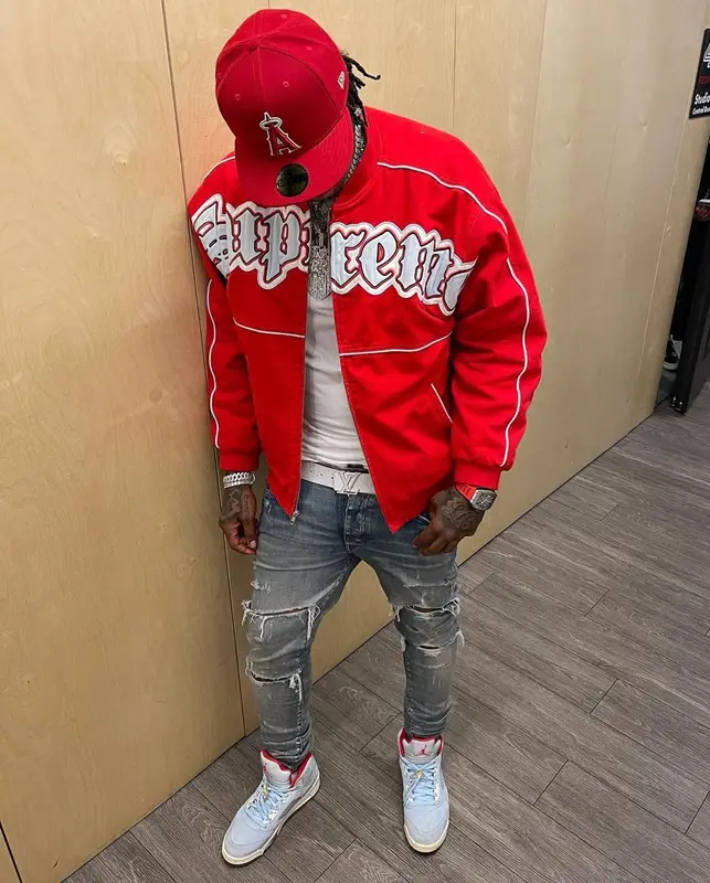 Moneybagg Yo outfit in Supreme, Louis Vuitton, and New Era, 2021