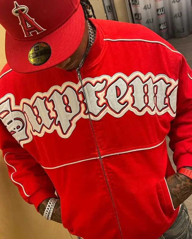 Moneybagg Yo outfit in Supreme, Louis Vuitton, and New Era, 2021