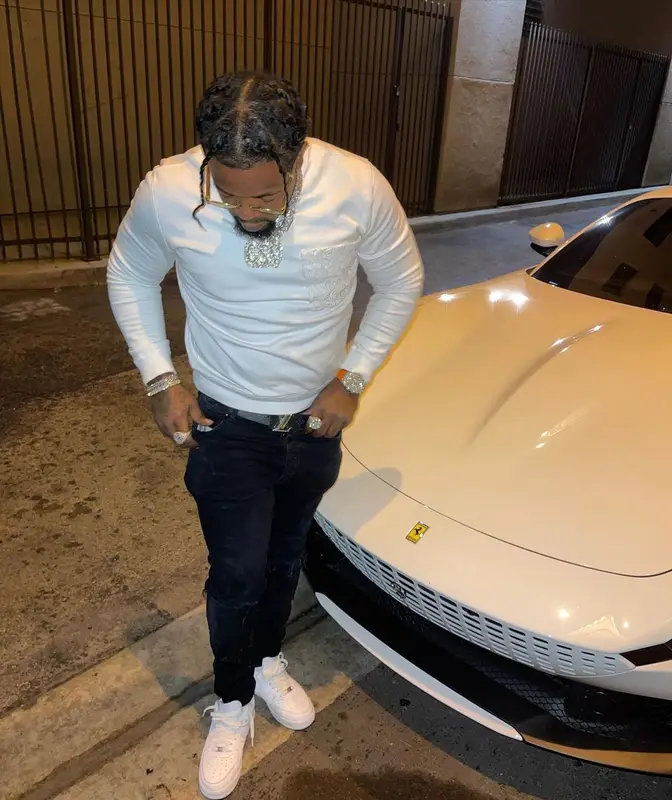 Rowdy Rebel outfit in Valentino, Amiri, and Louis Vuitton, 2021