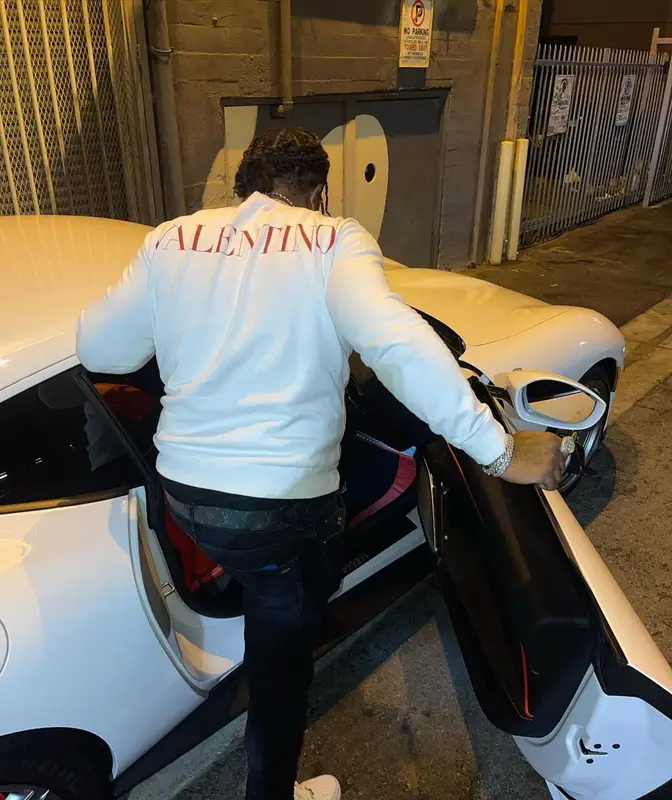 Rowdy Rebel outfit in Valentino, Amiri, and Louis Vuitton, 2021