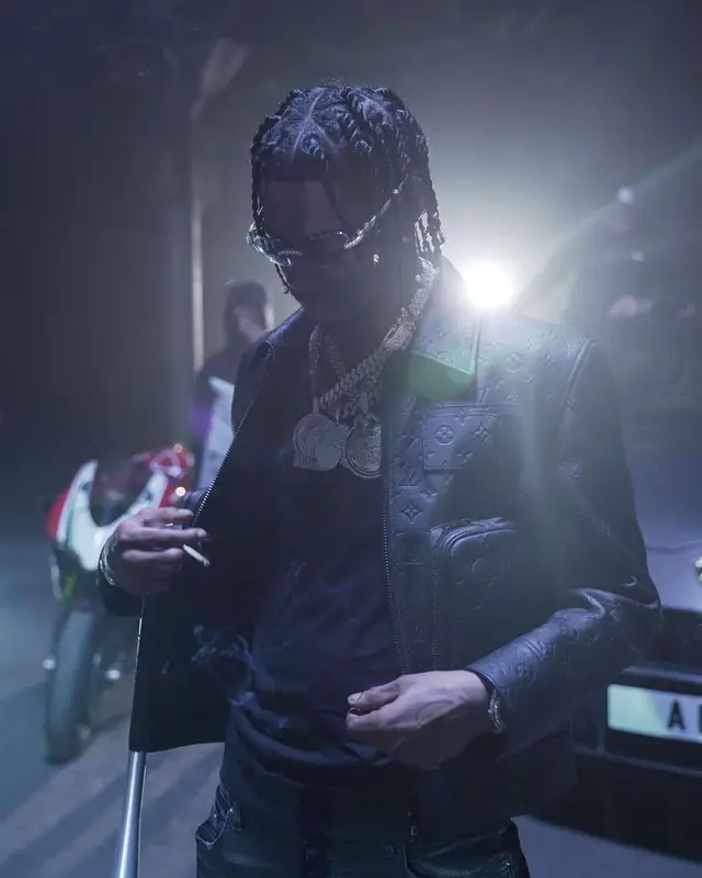 Russ Millions outfit in Louis Vuitton, Amiri, and Playboy, 2021
