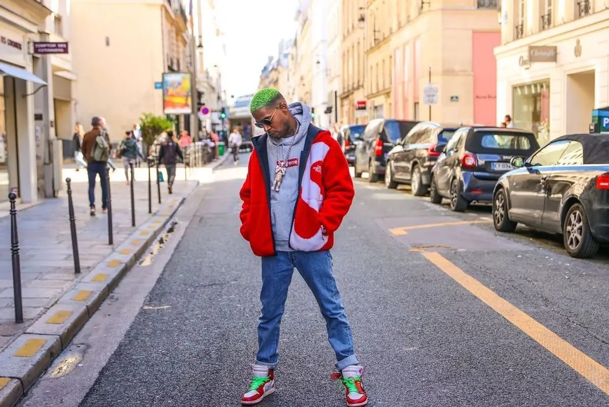 Kid Cudi outfit in Supreme, Nike, and The North Face, 2021