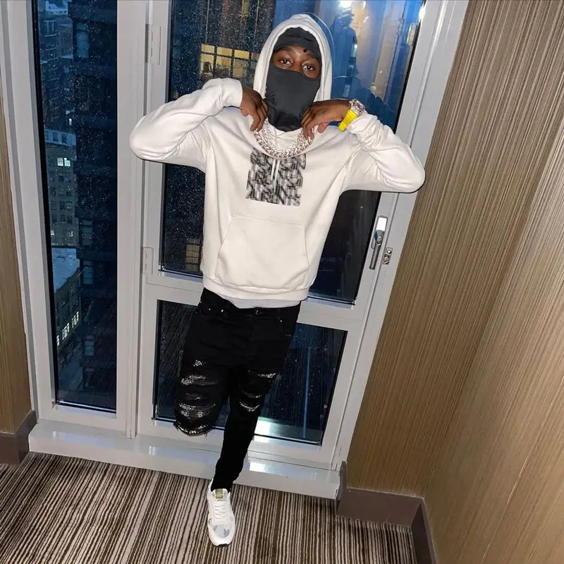 Lil Tjay outfit in Saint Laurent, Amiri, and Valentino, 2021
